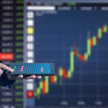 Person analyzing stock market data on tablet.