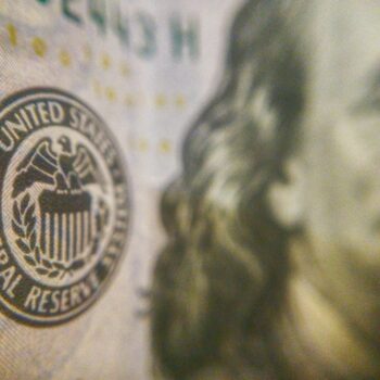 Close-up of Federal Reserve emblem on currency.