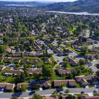 Aerial view of suburban neighborhood and landscape.